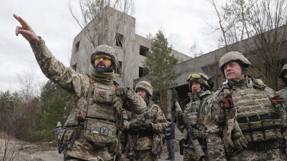 epa09772193 Reservists of the Ukrainian Territorial Defence attend a military exercise near Kiev, Ukraine, 19 February 2022, amid escalation on the Ukraine-Russian border. According to a survey conducted by the Kiev International Institute of Sociology (KIIS) from December 2021, 50.2 percent of Ukrainians said they would resist in case of a Russian military intervention into their city, town or village. Every third respondent to the poll said they were ready to engage in armed resistance, and 21.7 percent said they were ready to participate in civil resistance actions.  EPA/SERGEY DOLZHENKO