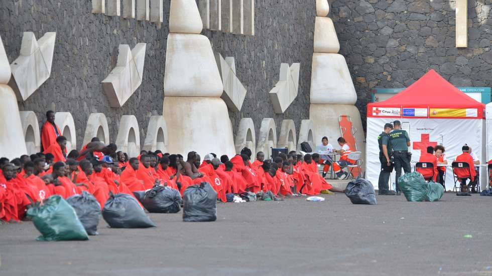 epa10928741 Officers check 148 sub-Saharan immigrants that include 20 minors and eight women, after arriving at the port of La Restinga, El Hierro, Canary Island, Spain, 20 October 2023.  EPA/Gelmert Finol