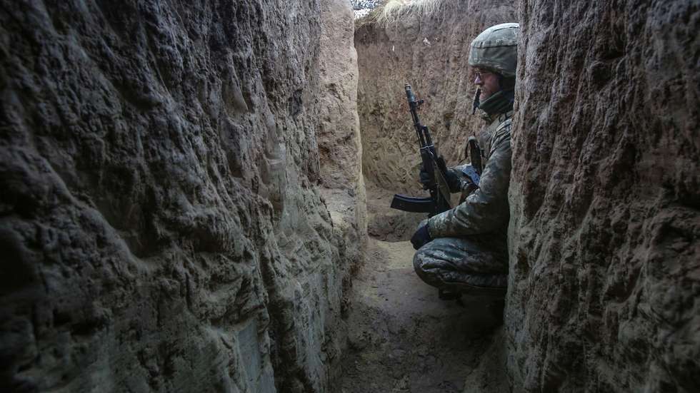 epa09619100 Ukrainian serviceman have a rest in a trench on a front line near the Svetlodarsk, not far from pro-Russian militants controlled city of Horlivka, Donetsk area, Ukraine, 03 December 2021. Ukrainian officials said Russia has amassed more than 90,000 troops along the Ukraine-Russian border but Moscow denies it is preparing an attack on Ukraine. US Secretary of State Blinken warned about serious consequences in case if Russia will start the conflict with Ukraine during Organization for Security and Co-operation in Europe (OSCE) foreign ministers meeting in Stockholm on 02 December 2021.  EPA/ANATOLII STEPANOV