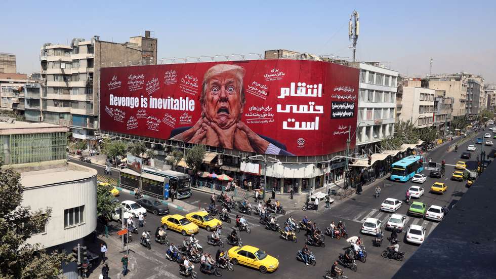 epa13178257 Iranians drive near an anti-Trump billboard in Tehran, Iran, 19 August 2026. Iranian parliament speaker Mohammad Bagher Ghalibaf said that the Strait of Hormuz will remain closed until the United States lifts its blockade and ends sanctions.  EPA/ABEDIN TAHERKENAREH RESTRICTIONS: NO Access Israel Media/Persian Language TV Stations Outside Iran/Strictly No Access BBC Persian/VOA Persian/Manoto TV/Iran International TV. (As mandated by Iran's Directorate General for Foreign Media) --