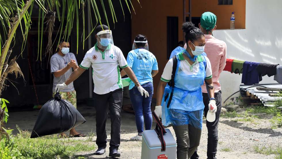 epa09075522 Healthcare workers prepare to conduct COVID-19 swab tests at a residential area in Dili, East Timor also known as Timor Leste, 15 March 2021. Timor Leste recorded the second-smallest covid-19 outbreak in Southeast Asia after Laos, reporting just 145 cases of the coronavirus. The country had imposed a state of emergency a week after detecting its first case on 21 March 2020, and enforced strict border controls.  EPA/ANTONIO DASIPARU