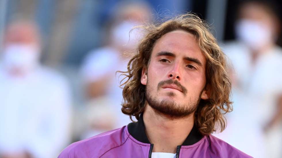 epa09268309 Stefanos Tsitsipas of Greece reacts after losing against Novak Djokovic of Serbia during their final match at the French Open tennis tournament at Roland Garros in Paris, France, 13 June 2021.  EPA/CAROLINE BLUMBERG