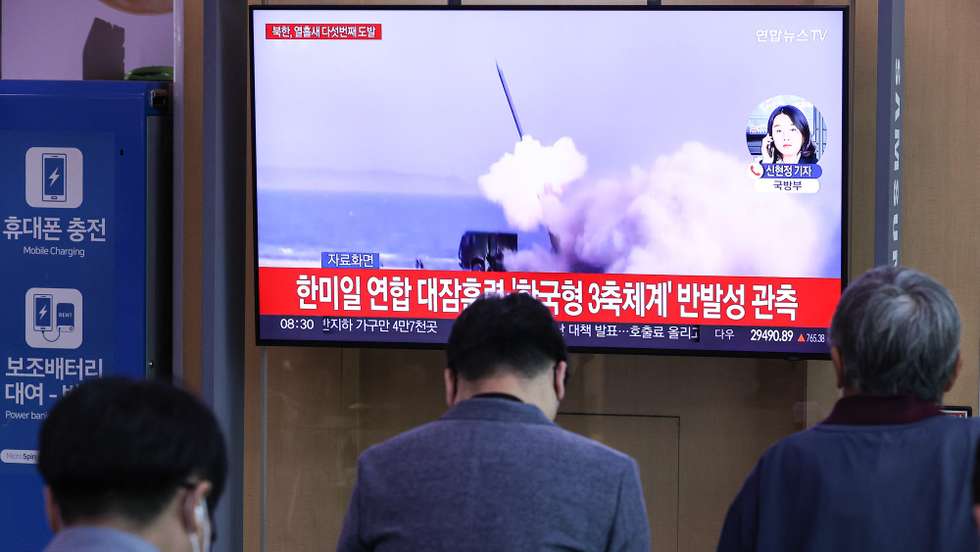 epa10221987 People watch a TV report on North Korea's firing of an intermediate range ballistic missile (IRBM) into the Pacific ocean past Japan earlier in the day, at Seoul Station, in Seoul, South Korea, 04 October 2022. North Korea has conducted five missile launches in just over a week in apparent protest of joint military exercises involving South Korea, the US and Japan, including a naval exercise with the USS Ronald Reagan aircraft carrier.  EPA/YONHAP  SOUTH KOREA OUT