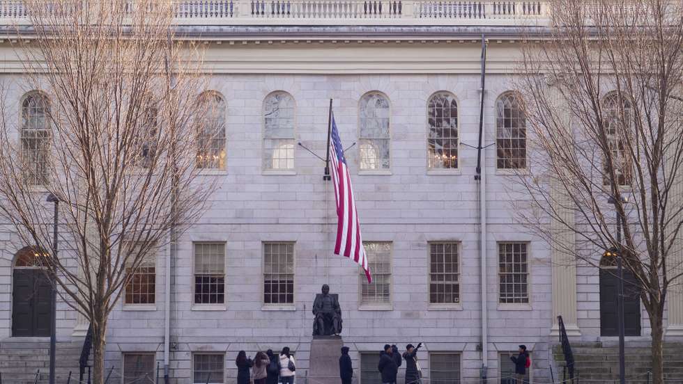 epa11055501 Tourists take photographs near the statue of John Harvard in Harvard Yard on the campus of Harvard University in Cambridge, Massachusetts, USA, 03 January 2024. Harvard University President Claudine Gay resigned as the shortest tenure of the position, in wake of plagiarism allegations and a recent congressional hearing regarding the response by the school to the Israel-Hamas war.  EPA/CJ GUNTHER