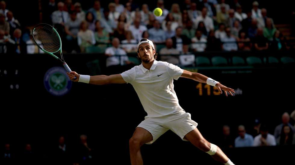epa11470675 Lorenzo Musetti of Italy in action during the Men's quarterfinal match against Taylor Fritz of the USA at the Wimbledon Championships, Wimbledon, Britain, 10 July 2024.  EPA/TIM IRELAND  EDITORIAL USE ONLY