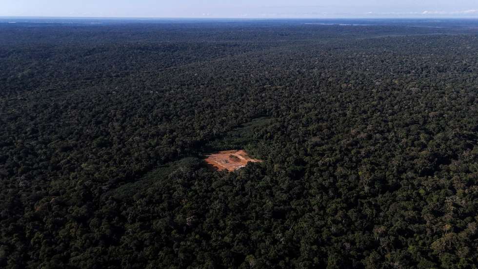 epa11423308 Aerial view shows a deforested area with a red-painted metal structure used to maintain pressure and control gas flow in the Amazon rainforest, Brazil, 14 June 2024 (issued 19 June 2024). The extraction of natural gas in the middle of the Brazilian Amazon has put the Mura people on the warpath. While the authorities speak of development for the region, this ethnic group fears for the rivers and forests on which it lives and has initiated a legal struggle to stop the project.  EPA/Antonio Lacerda