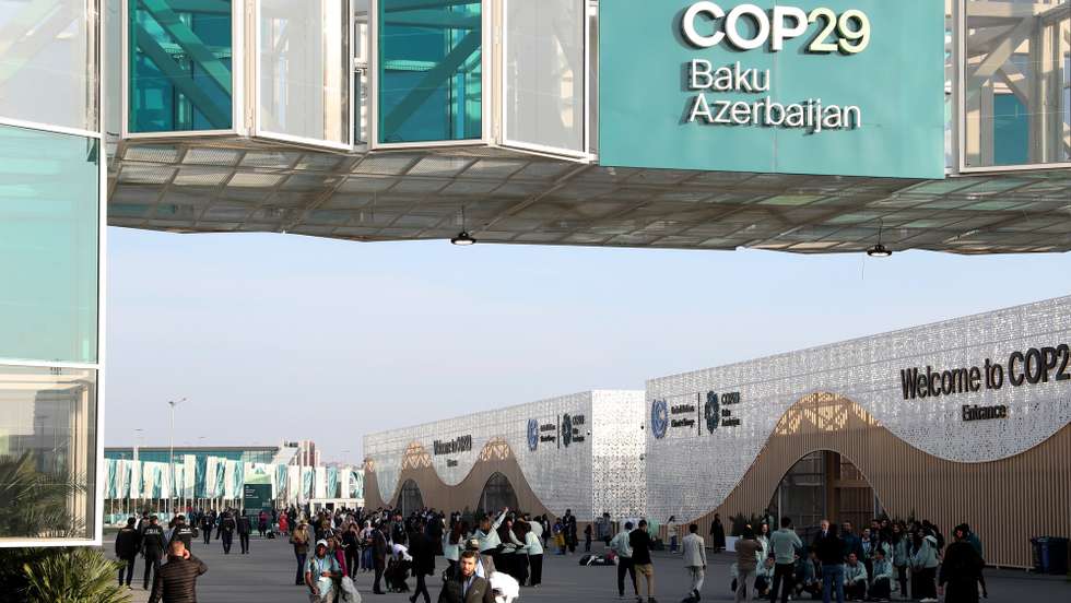 epa11734972 People leave the building after the end of the  United Nations Climate Change Conference COP29 in Baku, Azerbaijan, 22 November 2024. The Azerbaijani capital of Baku hosts the 2024 United Nations Climate Change Conference (COP29) from 11 to 22 November 2024.  EPA/IGOR KOVALENKO