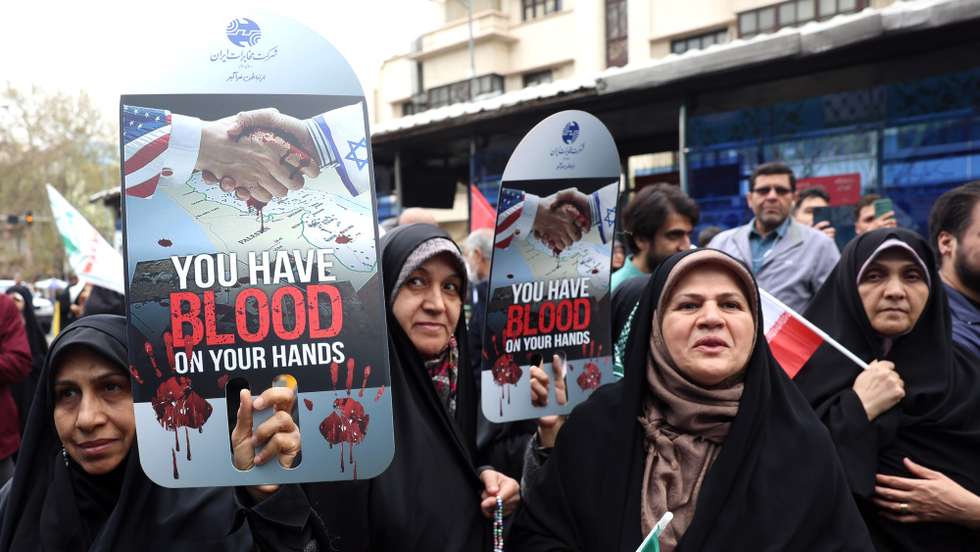 epa11994190 Iranian women hold placards during a rally marking Al-Quds Day in Tehran, Iran, 28 March 2025. Al-Quds Day is marked annually on the last Friday of the fasting month of Ramadan in various countries around the world, since it was established in Iran in 1979, to show solidarity with the Palestinians.  EPA/ABEDIN TAHERKENAREH