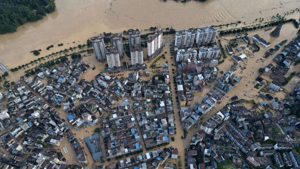 epa12205652 An aerial photo shows flood-stricken Rongjiang County, Guizhou Province, southwest China, 28 June 2025 (issued 30 June 2025). Heavy flooding has returned to Rongjiang County, prompting local authorities to re-activate the highest-level emergency flood response, effective from 12:30 p.m. on 28 June.  EPA/XINHUA / Liu Xu CHINA OUT / UK AND IRELAND OUT  /       MANDATORY CREDIT EDITORIAL USE ONLY