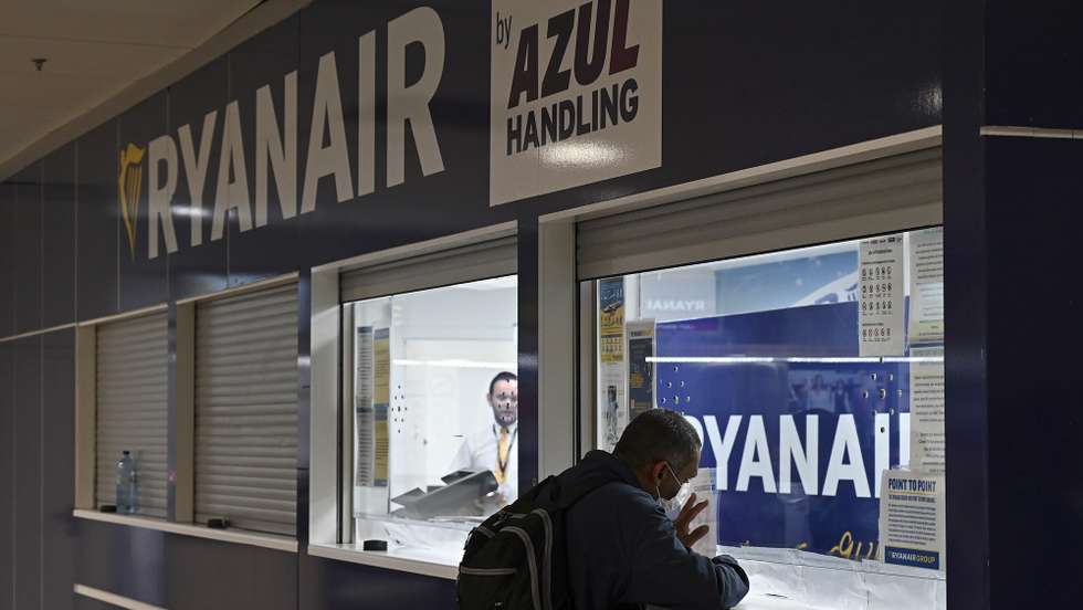 epa10031462 A man at a Ryanair customer service desk during the first day of strike called by Ryanair crew, at Adolfo Suarez Madrid Barajas international airport, in Madrid, Spain, 24 June 2022. Ryanair employees in Spain called for a strike on 24-26 June, 30 June and 01-02 July over dissatisfaction with working conditions and pay. More budget airlines across several European countries are expected to strike throughout July 2022.  EPA/FERNANDO VILLAR