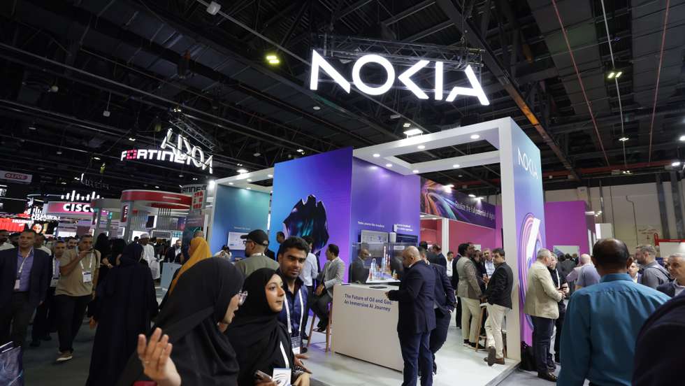 epa12451012 People visit the pavilion of Nokia at the Gulf Information Technology Exhibition (GITEX) Global 2025 in the Gulf emirate of Dubai, United Arab Emirates, 13 October 2025. The 45th edition of the annual GITEX Global runs until 17th October 2025.  EPA/ALI HAIDER
