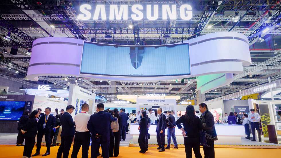epa12504365 Visitors stand at the Samsung booth during the 7th China International Import Expo (CIIE) in Shanghai, China, 05 November 2025. The 7th China International Import Expo is held in Shanghai from 05 to 10 November 2025.  EPA/ALEX PLAVEVSKI