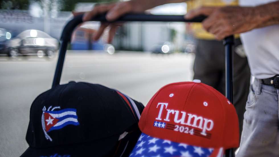 epa12979668 A person pushes a cart of baseball caps as Cubans in exile celebrate Cuba's Republic Day in Miami, Florida, USA, 20 May 2026. The date marks the formal establishment of the Republic of Cuba in 1902. This year's celebrations coincide with US prosecutors unsealing an indictment against former Cuban President Raul Castro over the 1996 shootdown of two civilian aircraft operated by Brothers to the Rescue.  EPA/CRISTOBAL HERRERA-ULASHKEVICH