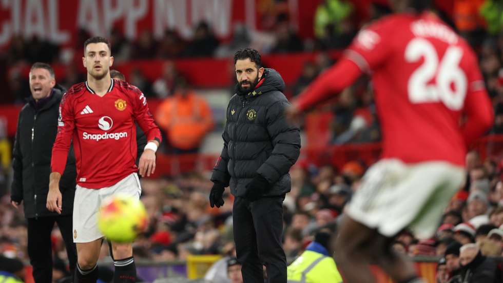 epa12618345 Manchester United's manager Ruben Amorim (C) reacts during the English Premier League match between Manchester United and Wolverhampton Wanderers, in Manchester, Britain, 30 December 2025.  EPA/ADAM VAUGHAN EDITORIAL USE ONLY. No use with unauthorized audio, video, data, fixture lists, club/league logos, 'live' services or NFTs. Online in-match use limited to 120 images, no video emulation. No use in betting, games or single club/league/player publications.