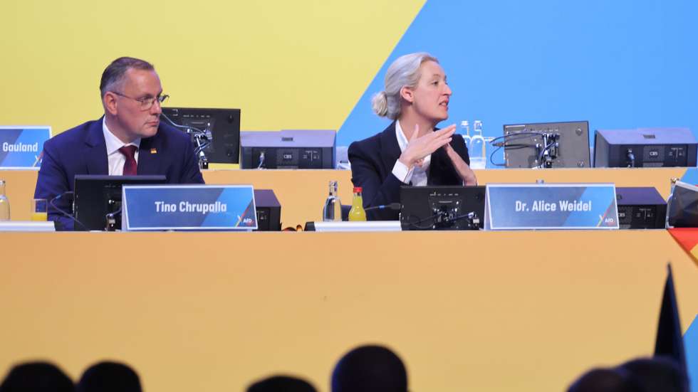 epa13085608 Reelected co-chairwoman of the Alternative for Germany (AfD) party and faction Alice Weidel (R) and reelected AfD co-chairman Tino Chrupalla (L) attend the AfD federal party congress in Erfurt, Germany, 04 July 2026. Thousands of counter-protesters are expected to converge on Erfurt as the far-right AfD party holds its 17th Federal Party Congress on 04 and 05 July in Erfurt.  EPA/HANNIBAL HANSCHKE