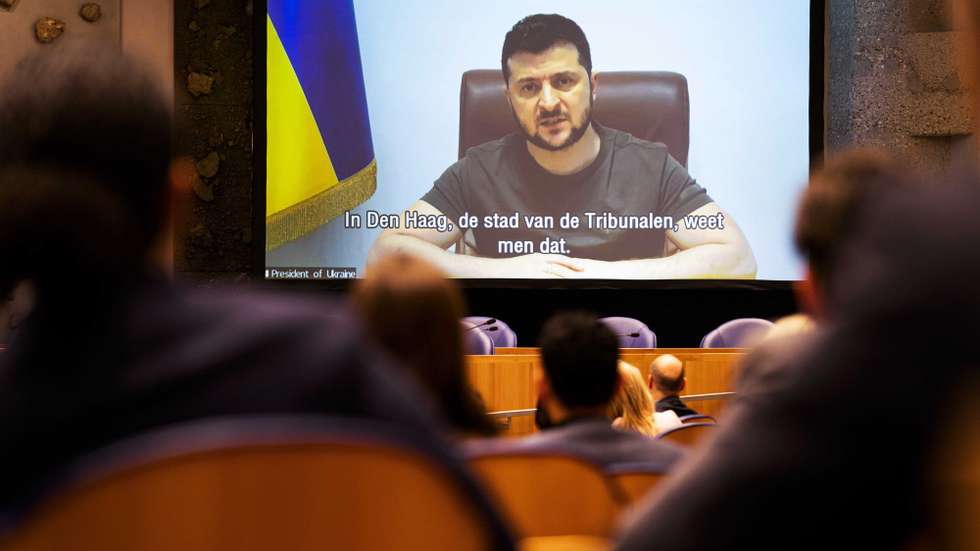 epa09861551 Ukrainian President Volodymyr Zelensky gives a speech in the House of Representatives via a video link in The Hague, The Netherlands, 31 March 2022. The Ukrainian President Zelensky has addressed the parliaments of more countries in hopes of rallying support for his government in response to Russia's invasion of his country.  EPA/BART MAAT