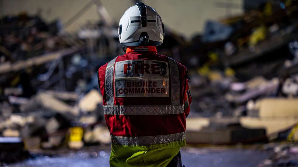 epa10360992 Handout image provided by the Government of Jersey taken on the 10 December 2022 of emergency personnel at the scene of an explosion and fire at a block of flats in St Helier, Jersey, Britain. At least three people have died and 12 are missing following the blast.  EPA/GOVERNMENT OF JERSEY HANDOUT MANDATORY CREDIT HANDOUT EDITORIAL USE ONLY/NO SALES