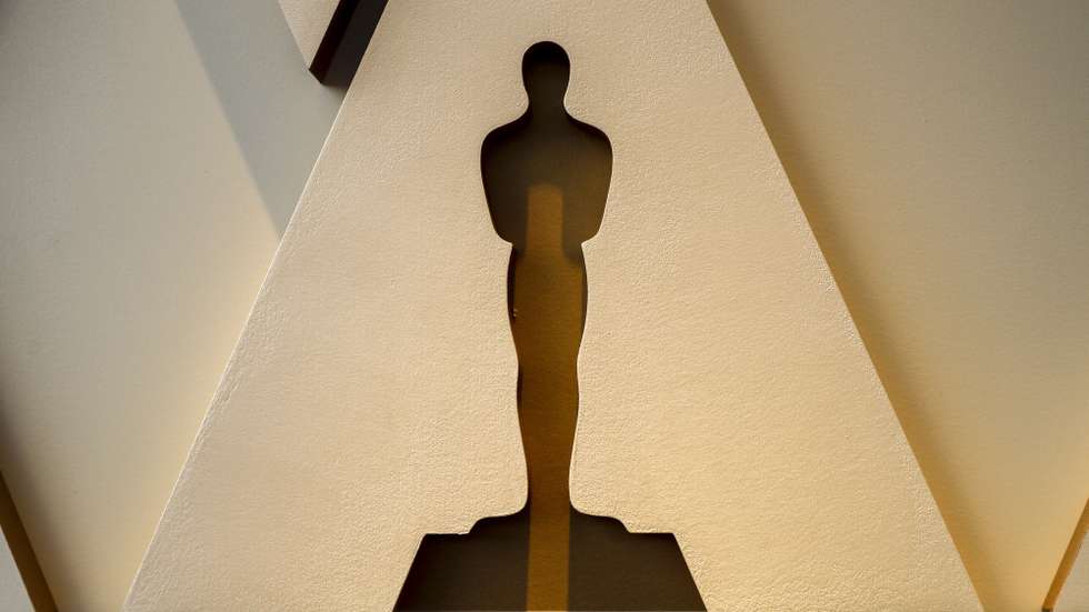 epa09849471 An Oscar silhouette is displayed on the red carpet as workers set up the area for the 94th annual Academy Awards ceremony in front of the Dolby Theater in Hollywood, California, USA, 25 March 2022. The Oscars will be presented at the Dolby Theatre for outstanding individual or collective efforts in filmmaking on 27 March 2022.  EPA/ETIENNE LAURENT