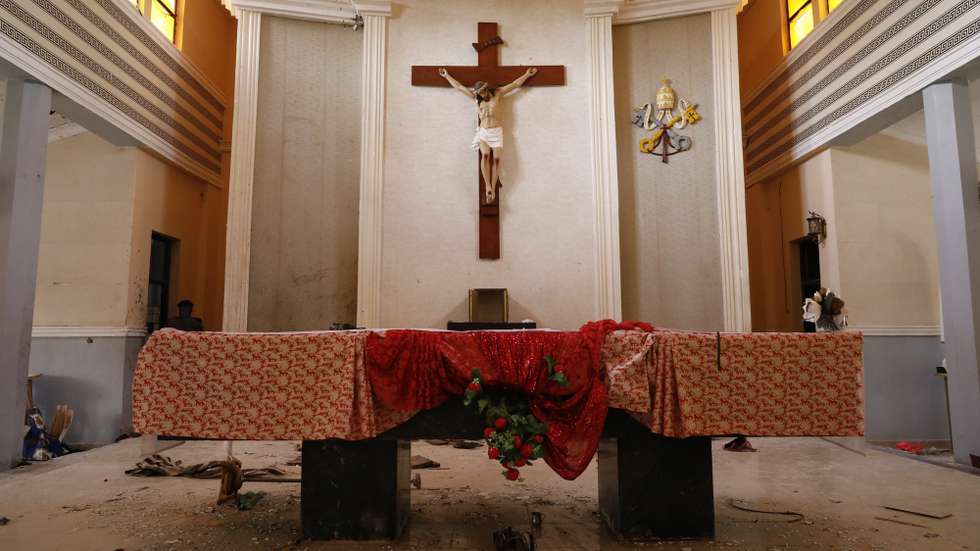epa09999603 A cross on the altar stained with blood inside the St. Francis Catholic church a day after an attack by gunmen on worshippers during a Sunday service mass in Owo, Ondo state, Nigeria, 06 June 2022. According to Ondo state authorities over 50 people were killed and numerous others injured in the attack on the St. Francis Catholic church in Owo town, southwest Nigeria, during Pentecost Sunday mass on 05 June 2022.  EPA/STRINGER