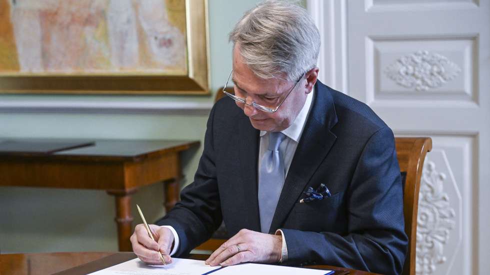 epa09953132 Finnish Foreign Minister Pekka Haavisto signs his country's application for NATO membership in Helsinki, Finland, 17 May 2022. Finland's Parliament approved on the day a proposal for the country's application for NATO membership, with 188 votes in favor and eight against. Finland and Sweden have confirmed their intention to apply for NATO membership as a result of Russia's invasion of Ukraine. The move would bring the expansion of the Western military alliance to 32 member countries.  EPA/KIMMO BRANDT