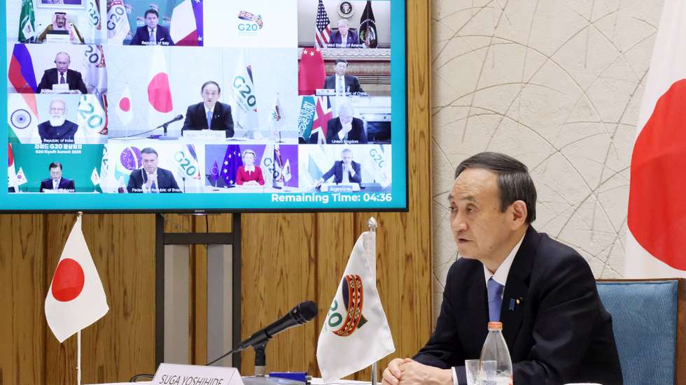 epa08834918 A handout photo made available by Japan's Cabinet Public Relations Office shows Japan's Prime Minister Yoshihide Suga speaks from Tokyo during the online G-20 summit, at the prime minister's office in Tokyo, Japan, late 21 November 2020. The G20 summit 2020 is held on in a virtual format due to Covid-19 pandemic caused by SARS-CoV-2 coronavirus.  EPA/JAPAN'S CABINET PUBLIC RELATIONS OFFICE / JIJI PRESS / HANDOUT JAPAN OUT EDITORIAL USE ONLY/ HANDOUT NO ARCHIVES