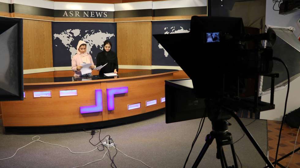 epaselect epa08672850 Afghan women journalists work at Asr News TV station in Herat, Afghanistan, 16 September 2020. Nearly 19 years after the fall of the Taliban regime and the United States invasion, the Afghan government and insurgents on 12 September, began peace negotiations in Doha. Unlike the Taliban team, the 21-member negotiating group sent by Kabul includes four women, who - among other things - will look to safeguard the progress on women's rights since the fall of the Taliban regime that had prevented girls from going to schools and confined women to their homes.  EPA/JALIL REZAYEE