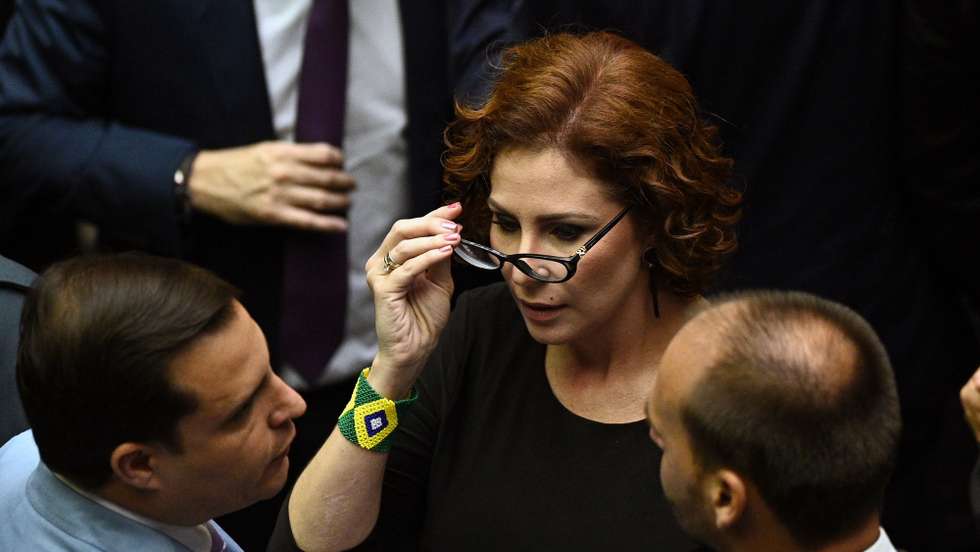 epa10442844 The elected deputy Carla Zambelli participates in the election ceremony for the heads of the respective chambers, at the National Congress, in Brasilia, Brazil, 01 February 2023. The Brazilian Parliament inaugurates on 01 February a new legislature, the first of the Government of Luiz Inacio Lula da Silva, and elects new authorities with a conservative composition that could hinder the plans of the progressive leader.  EPA/Andre Borges