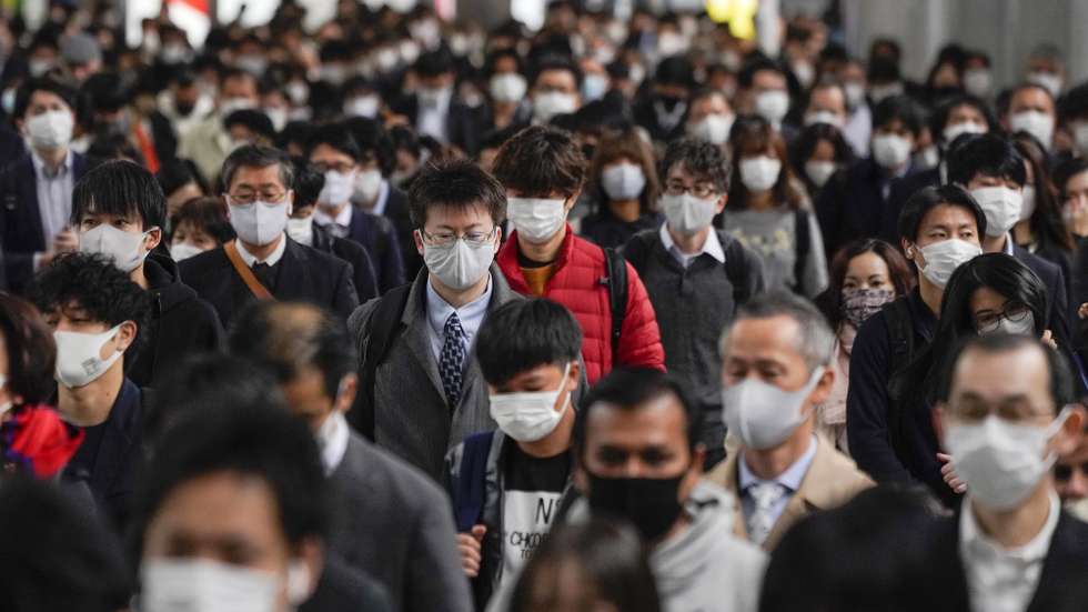 epa08897237 (FILE) - (FILE) Commuters walk to work after exiting from their packed commuter trains at Shinagawa railway station in Tokyo, Japan, 24 November 2020 (reissued 21 December 2020). According to latest media reports, the total number of coronavirus disease (COVID-19) infections in Japan has exceeded the 200,000 mark since the start of the pandemic.  EPA/KIMIMASA MAYAMA