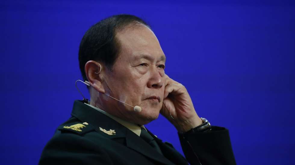 epa10008980 China’s Minister of National Defense Wei Fenghe adjusts his earphone before delivering his speech, during the fifth plenary session of the International Institute for Strategic Studies (IISS) Shangri-la Dialogue at the Shangri-la hotel in Singapore, 12 June 2022. Defense ministers and officials from 42 countries are gathered in the city state for the IISS Shangri-la Dialogue, an annual high level defence summit in the Asia Pacific region that has been on hold for the past two years due to the Covid-19 pandemic. The summit will be held from 10-12 June 2022  EPA/HOW HWEE YOUNG