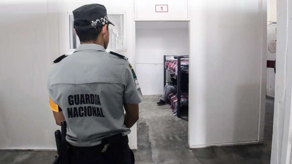 epa11853621 A member of Mexico's National Guard (GN) guards a shopping mall in Tijuana, Mexico, 25 January 2025. Mexico's President Claudia Sheinbaum announced that government authorities opened a temporary shelter in the border city to accommodate migrants who were deported from the United States under US President Donald Trump's restrictive measures.  EPA/JOEBETH TERRIQUEZ