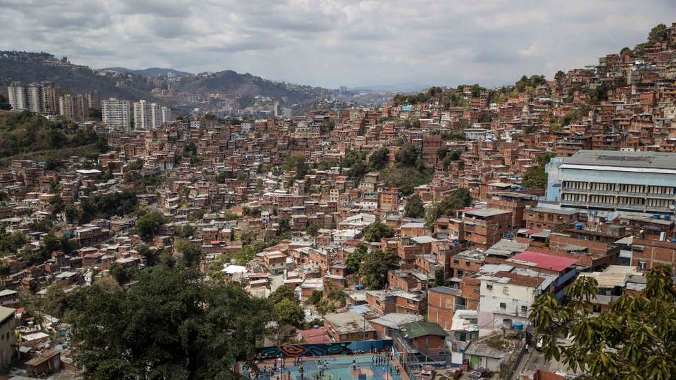 epa09784509 Children attend a carnival party at the Petare favela in Caracas, Venezuela, 22 February 2022 (issued 25 February 2022). Residents and community leaders of Petare, the largest favela in Caracas, held the gathering for children to celebrate the annual festivities despite a lack of resources for costumes and decorations and amid an ever-worsening economic crisis in the country.  EPA/Miguel Gutierrez