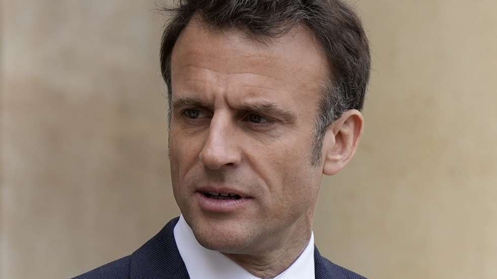 epa10571956 French President Emmanuel Macron looks on as he talks with Senegalese war veterans at the Elysee Palace in Paris, France, 14 April 2023. Some of the last survivors in France from a colonial-era infantry corps that recruited tens of thousands of African soldiers to fight in French wars around the world will be able to live out their final days with family members back in Africa after a French government U-turn earlier this year on their pension rights.  EPA/Lewis Joly / POOL   MAXPPP OUT