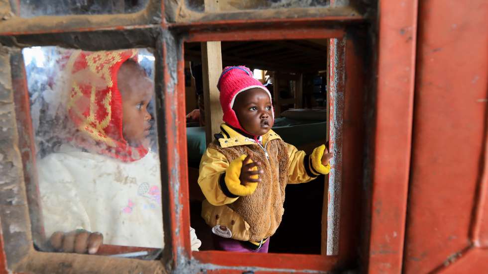 epa09030761 Small children belonging to Kenyan teenage mothers (C), lookon as they wait for their mothers from their dormitory before their tea break at the Serene Haven Girls Secondary School, in Kiawara in Kieni, Nyeri, Kenya, 10 February 2021 (issued 23 February 2021). The private school in Central Kenya was founded by Elizabeth Wanjiru Muriuki with an aim to open doors to teenage pregnant girls, teenage mothers, and their babies, as a second chance by ensuring they get an education despite the stigma. The school hosts at least 20 girls with 8 pregnant and 12 already delivered who either got pregnant or gave birth during the country’s lockdown due to COVID-19. The school allows the teenage mothers to live with their babies in their dormitories where they come to attend to them during their break times from their classes.  EPA/DANIEL IRUNGU