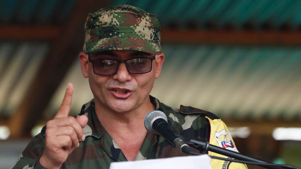 epa10576178 General Commander of the FARC dissidents, alias 'Ivan Mordisco' speaks during a meeting at Casa Roja, department of Caqueta, Colombia, 16 April 2023. Nestor Gregorio Vera Fernandez, alias 'Ivan Mordisco' and top leader of the Central General Staff (EMC) asked the guerrillas of the National Liberation Army (ELN) to 'put an end' to the active conflict between those two groups. The EMC, the main dissidence of the former FARC, announced on 16 April that the peace dialogue table with the Government of Colombia will be officially established on 16 May.  EPA/Ernesto Guzman