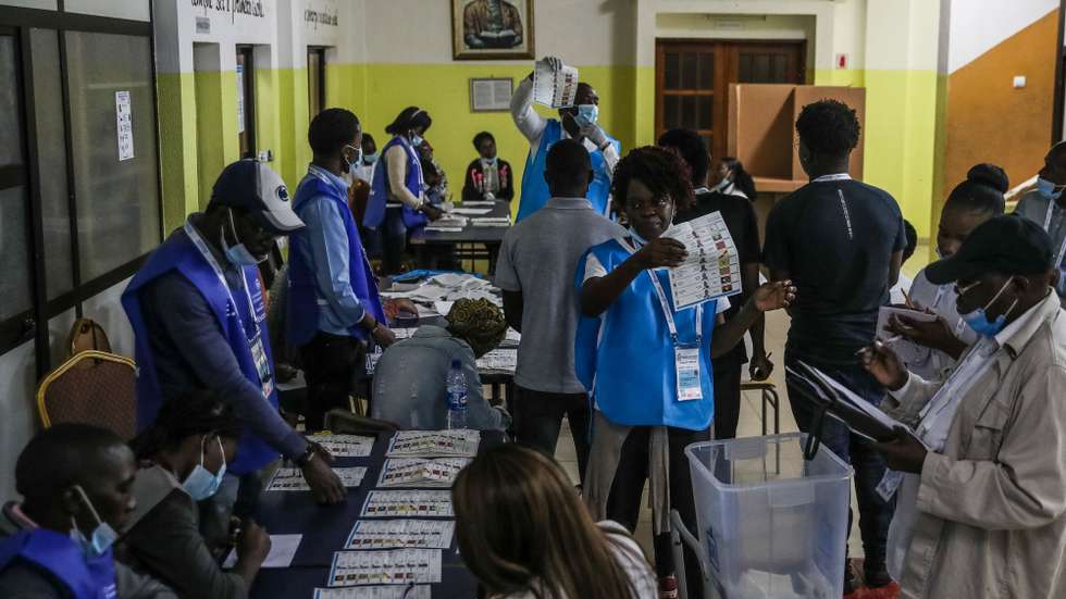 Election officials count the votes after the polls closed in the general elections at a polling station in Luanda, Angola, 24 August 2022. The general elections will define the composition of parliament and the names of the President and Vice President of the Republic. PAULO NOVAIS/LUSA