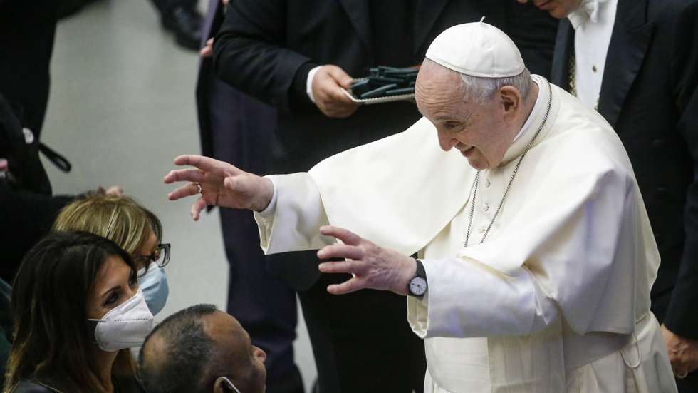 epa09533757 Pope Francis greets the faithful during his weekly General Audience in the Paul VI Audience Hall, in Vatican City, 20 October 2021.  EPA/FABIO FRUSTACI