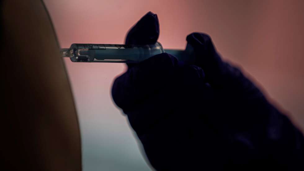 epa09124052 A person receives a dose of vaccine at the Wizink Center sports pavilion in Madrid, central Spain, 09 April 2021, on the first day of its operating as a new vaccination point against Covid-19 with AstraZeneca's vaccine. For the time being, AstraZeneca's vaccine will only be administered to people between 60 and 65 years of age following the decision of Spain's Ministry of Health and regional governments to halt it for people under 60.  EPA/Emilio Naranjo