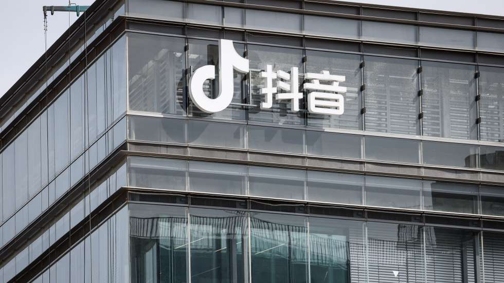 epa10525606 The Douyin logo, the Chinese counterpart of TikTok is seen on a ByteDance office in Beijing, China, 16 March 2023. The Biden administration has threatened to ban TikTok in the US if the Chinese owners don'tsell their stakes.  EPA/MARK R. CRISTINO