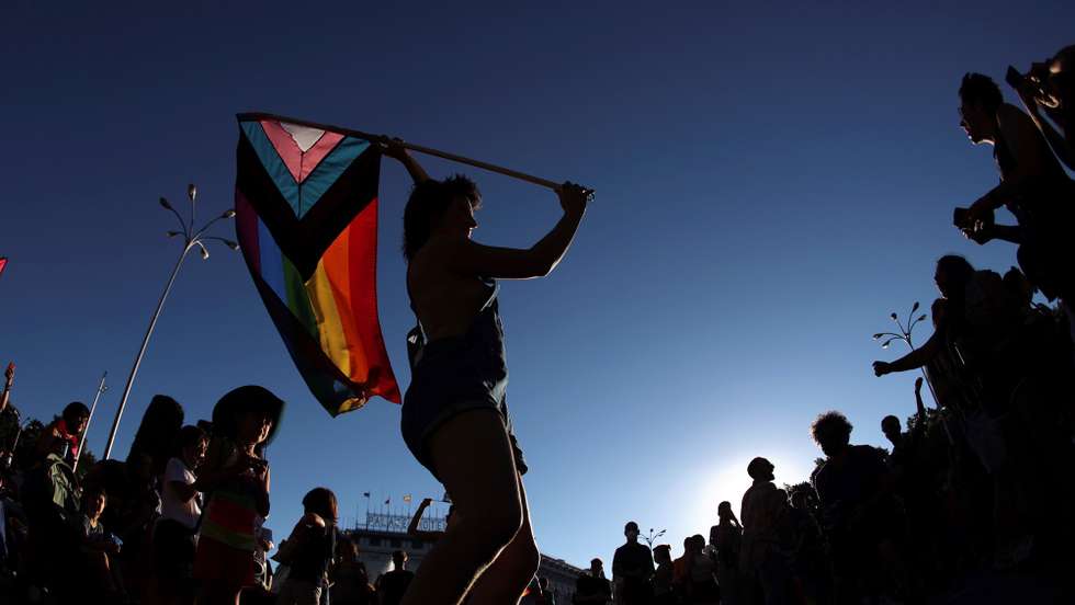 epa09309313 A participant waves a rainbow flag as people take part in the LGBT Pride Parade in Madrid, Spain, 28 June 2021. The Spanish association 'Madrid's Critical Pride' (Orgullo CrÃ­tico) organized the march under the slogan 'Neither Assigned Sex, Nor Proven Gender. Trans Fury Against All Authority' to call for equal rights and treatment around the world.  EPA/Rodrigo Jimenez