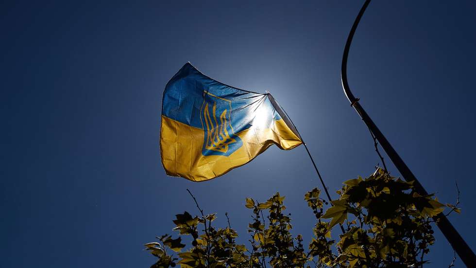 epa09906476 People with Ukrainian national flags take part in a demonstration against the Russian invasion of Ukraine, in front of the Russian embassy in Madrid, Spain, 24 April 2022. Russian troops invaded Ukraine on 24 February resulting in fighting and destruction in the country, and triggering a series of severe economic sanctions on Russia by Western countries.  EPA/Miguel Oses