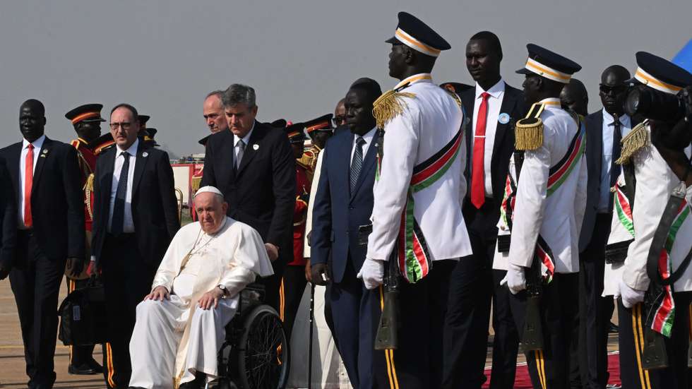 epa10445608 Pope Francis (C) looks on during a welcoming ceremony at the Juba International Airport in Juba, South Sudan, 03 February 2023. Pope Francis arrived on a three-day visit to South Sudan to promote peace and reconciliation in the world's youngest country, riven by the scars of civil war and extreme poverty.  EPA/CIRO FUSCO