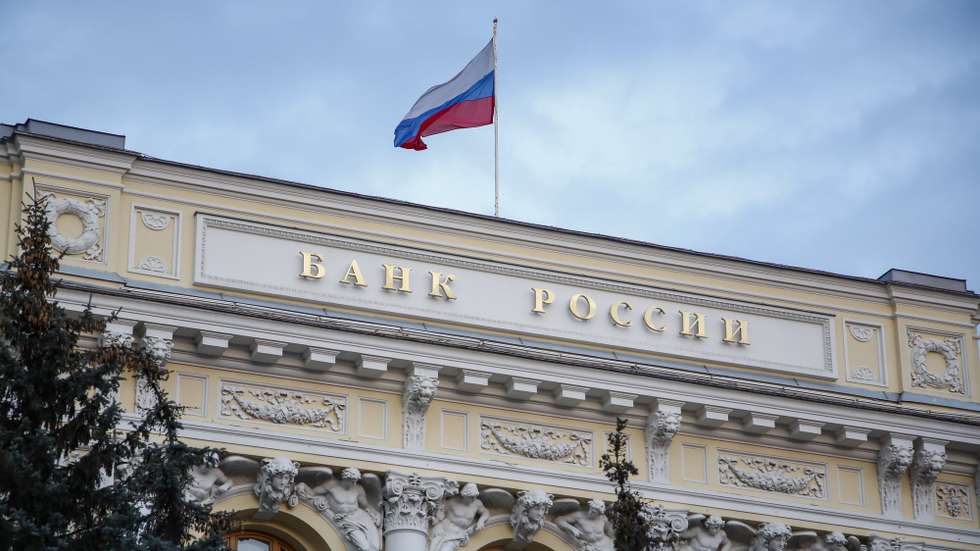 epaselect epa09791192 The Russian National flag waves atop the Bank of Russia headquarters in Moscow, Russia, 28 February 2022. The Bank of Russia decided to raise the key rate from 9.5 percent to 20 percent per annum starting 28 February. The Central Bank attributed this to a radical change in external conditions. The measure was taken in light of harsh sanctions imposed by the international community on Russia following its troops entering Ukraine on 24 February, and the subsequent collapse of the ruble.  EPA/SERGEI ILNITSKY