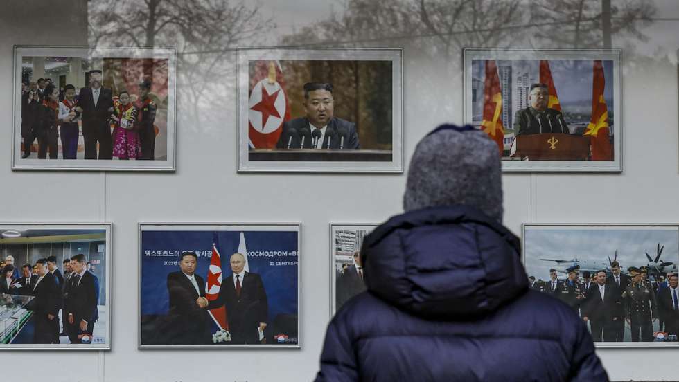 epaselect epa11691980 A person looks at photos of North Korean Leader Kim Jong Un, outside of the Embassy of the Democratic People's Republic of Korea (DPRK) in Moscow, Russia, 30 October 2024. North Korean state news agency KCNA and Russian officials on 30 October confirmed that North Korean Foreign Minister Choe Son Hu was traveling to Moscow after arriving in Vladivostok the previous day. Choe's visit comes after NATO joined Seoul, Washington and Kyiv in confirming Pyongyang's deployment of troops to Russia's Kursk region on the border with Ukraine.  EPA/YURI KOCHETKOV