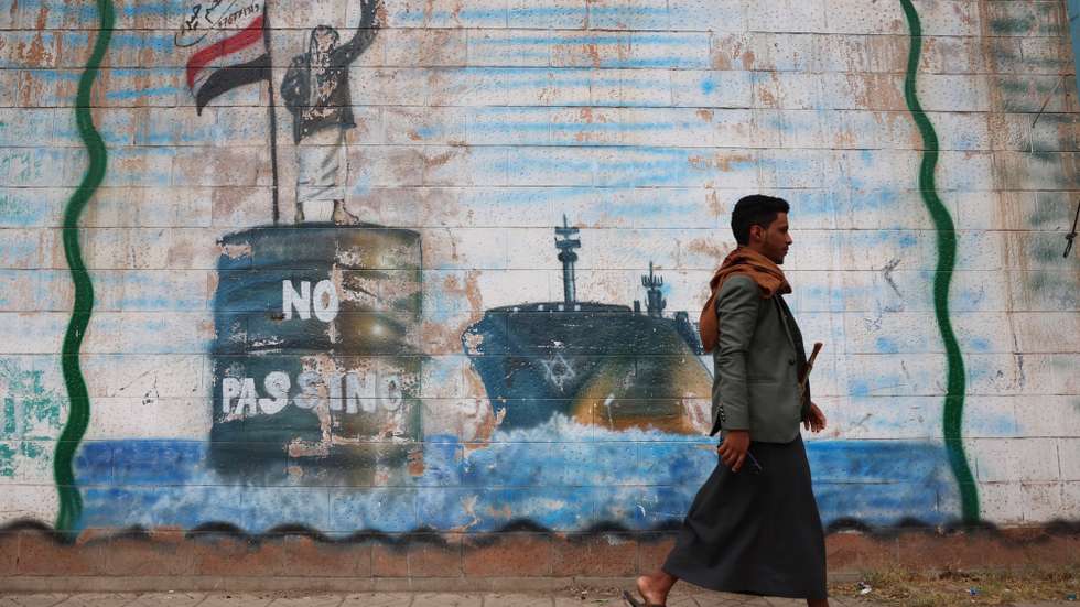 epaselect epa12226407 A person passes an anti-Israel mural sprayed on a wall, depicting a Houthi fighter stopping an Israeli ship off the coast of Yemen, in Sana'a, Yemen, 09 July 2025. Yemen’s Houthis have confirmed that the Liberian-flagged bulk carrier Magic Seas sank in the Red Sea off the coast of Yemen, a day after it was struck by rockets and explosive-laden remote-controlled boats. The attack was in response to Israel’s military operation in the Gaza Strip, according to a statement by Houthi military spokesman Yahya Sarea.  EPA/YAHYA ARHAB