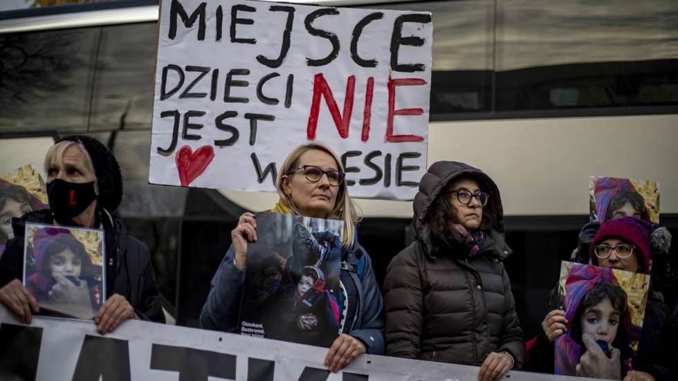 epa09593607 People protest against humanitarian situation on the Polish-Belarusian border focusing on childrens, in city of Hajnowka, near the Polish-Belarusian border, eastern Poland, 20 November 2021. Hundred people took part in protest organized by 'Mothers at the Border' and they request that the Polish authority accept or give asylum to refugees to children and their mothers. Poland has been struggling to stem the flow of asylum-seekers, refugees and migrants crossing into the country from Belarus. The Polish government says the migrants have been invited to Belarus by the Belarusian president, allegedly under the promise they will be able to live in the EU.  EPA/MARTIN DIVISEK