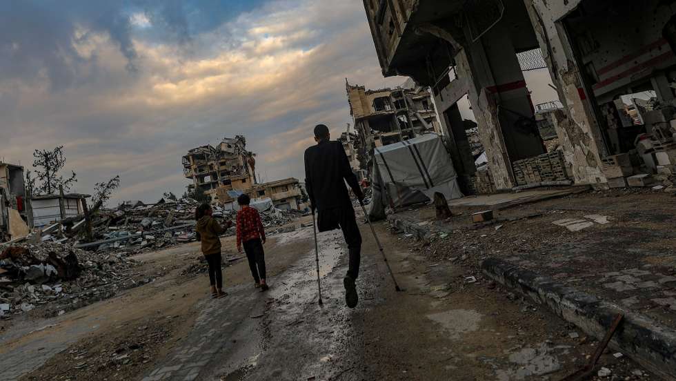 epa12590551 A Palestinian amputee walks in Yafa street among the destroyed Al Mahata mosque and destroyed buildings, in Al Tuffah neighbourhood, east of Gaza City, 13 December 2025, near the yellow line amid a ceasefire between Israel and Hamas. Around 1.9 million people in Gaza, nearly 90 percent of the population, have been displaced since the Israel-Hamas conflict began in October 2023, according to the UN.  EPA/MOHAMMED SABER