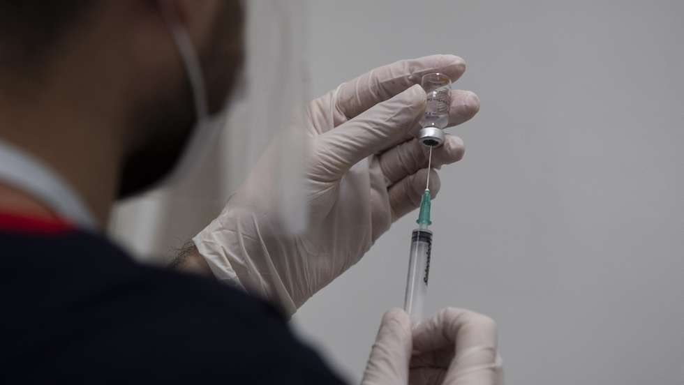 epa08968131 A Turkish nurse prepares a vaccine against COVID-19 with Sinovac's  vaccine at the Sancaktepe Education and Research Hospital, in Istanbul, Turkey, 27 January 2021. Turkey began mass vaccinations against COVID-19 starting with health workers on 14 January after the Chinese Sinovac vaccine received emergency approval. Turkey on 25 January received 6.5 million more doses of the vaccine against COVID-19 from China as the nationwide vaccination began for those aged 80 and older.  EPA/TOLGA BOZOGLU