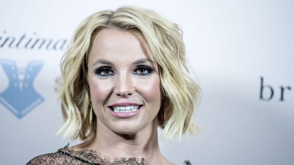 epa08398618 (FILE) - US singer Britney Spears smiles during the launch of her new lingerie brand 'The Intimate Britney Spears' with an event at the Forum in Copenhagen, Denmark, 25 September 2014 (reissued 03 May 2020). Reports from 02 May 2020 state that a judge in California extended the conservatorship on Spears until end of August 2020. The reports on an order authorising Britney's temporary conservator's extended term come only few days after Spears accidentally set her gym on fire.  EPA/CHRISTIAN LILIENDAHL  DENMARK OUT *** Local Caption *** 51587619
