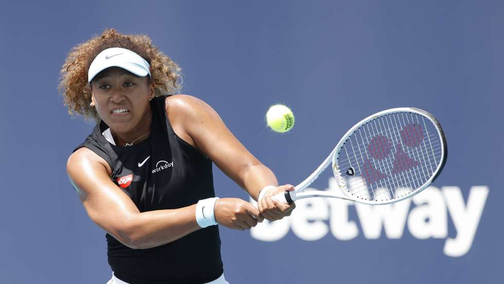 epa09109111 Naomi Osaka of Japan in action against  Maria Sakkari of Greece during their Women's quarterfinals singles match at the Miami Open tennis tournament in Miami Gardens, Florida, USA, 31 March 2021.  EPA/RHONA WISE