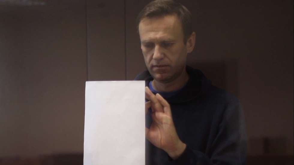 epa09015510 A still image taken from a handout video footage made available by the press service of the Babushkinsky district court shows Russian opposition leader Alexei Navalny inside a glass cage prior to a hearing of a case on slander charges in Moscow, Russia, 16 February 2021. In June 2020 the Russian Investigative Committee opened a criminal case against Alexei Navalny on charges of slander against WWII veteran Ignat Artemenko after NavalnyÃ•s comment about a video promoting the amendments to the Russian Constitution.  EPA/BABUSHKINSKY DISTRICT COURT PRES -- MANDATORY CREDIT -- BEST QUALITY AVAILABLE -- HANDOUT EDITORIAL USE ONLY/NO SALES